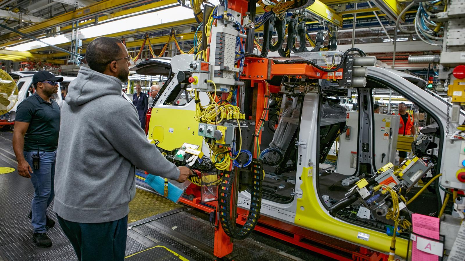 GM employee working on the vehicle assembly line.
