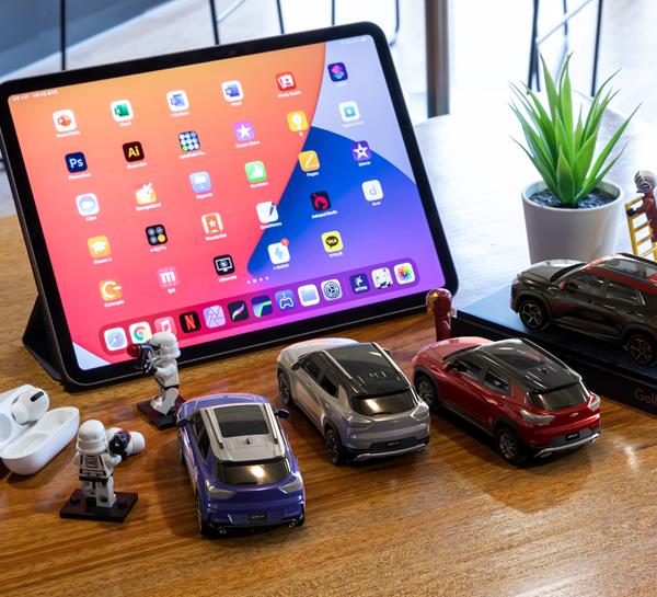 Chevrolet car models looking at tablet