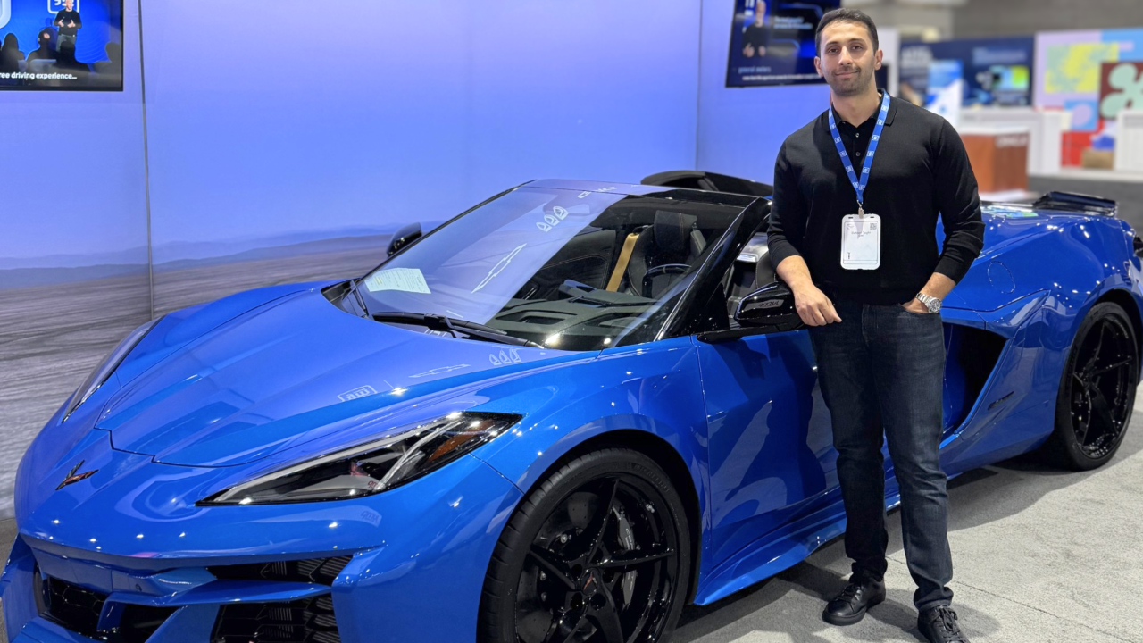 Ai Robotics Lead Dr Behrad Toghi With A Chevrolet Corvette E Ray At Neurips 2025