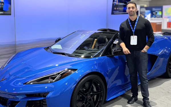 Ai Robotics Lead Dr Behrad Toghi With A Chevrolet Corvette E Ray At Neurips 2025