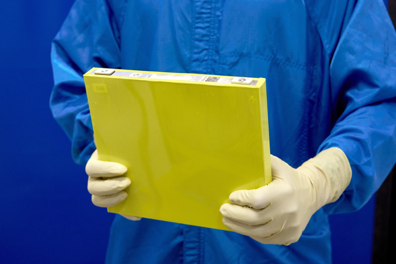 An Employee Holds A Full Size Prototype LMR Battery Cell At The General Motors Wallace Battery Cell Innovation Center